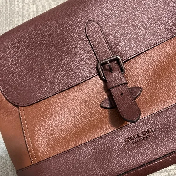 Mens Coach laptop bag. NEVER used. No tag, it was a gift. Perfect condition.